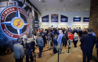 Attendees shuffle into the entrance of the AAAA Summit 2022 venue.